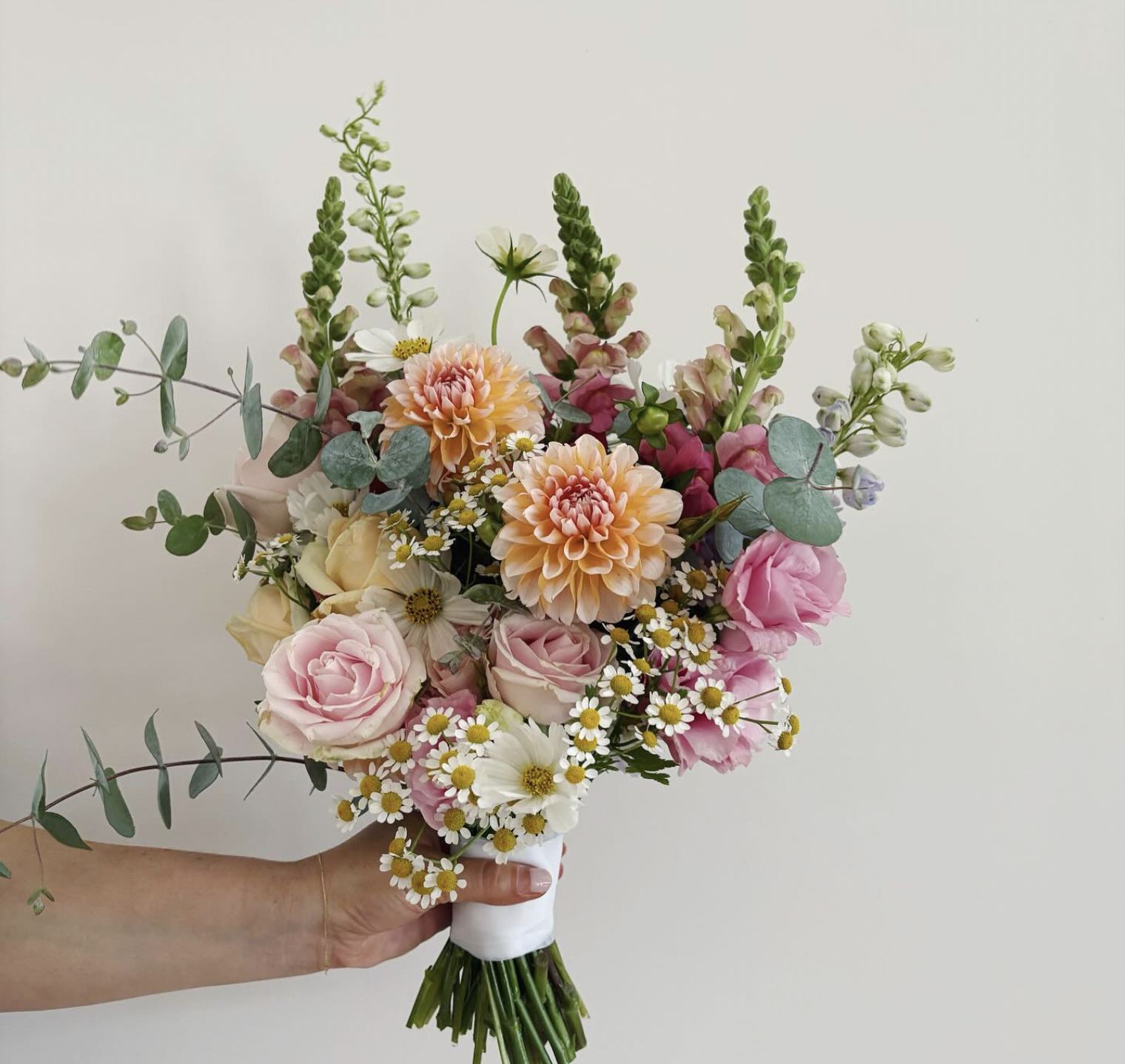 Bridal bouquet with dahlias, roses and chamomile