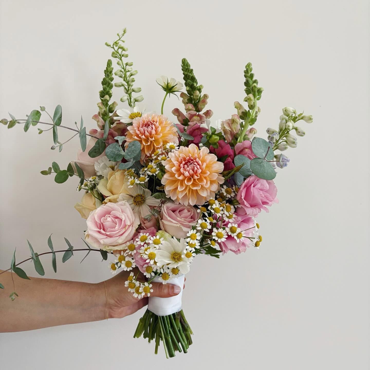 Pink and peach dahlia bouquet with garden roses