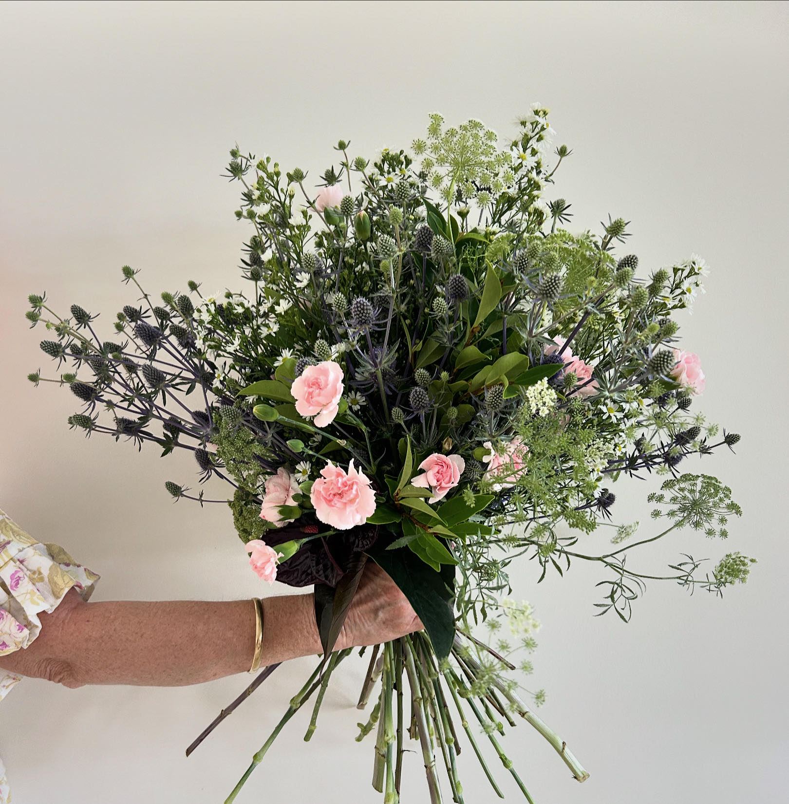 Soft apology bouquet with pink roses and thistle